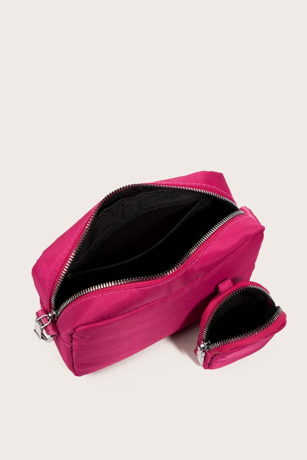 polyester shoulder handbag with small purse, cerise, top-down interior view, white background