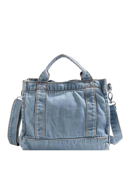 denim shoulder handbag, light blue, rear view, white background