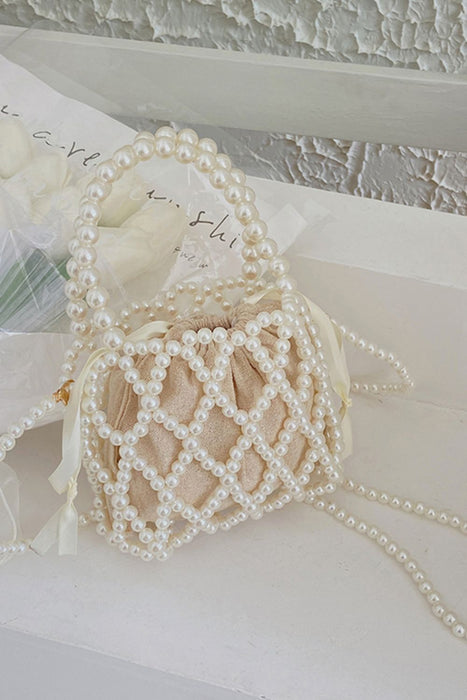 pearl polyester crossbody handbag, white pearl, on white countertop