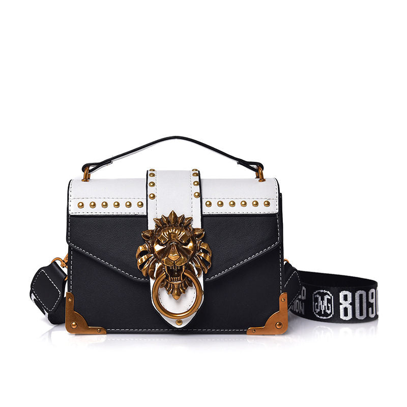 shoulder handbag with metal lion head closure, black, front view, white background
