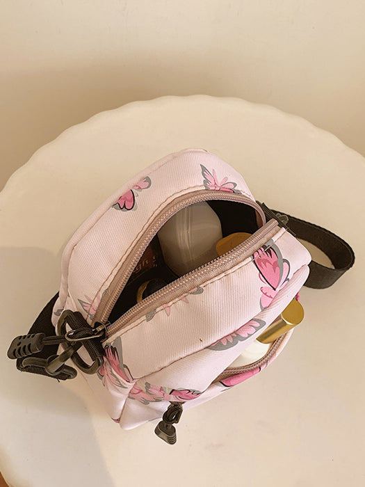 butterfly print polyester shoulder handbag, pink with pink butterflies, top-down interior view, products inside handbag, on white stand