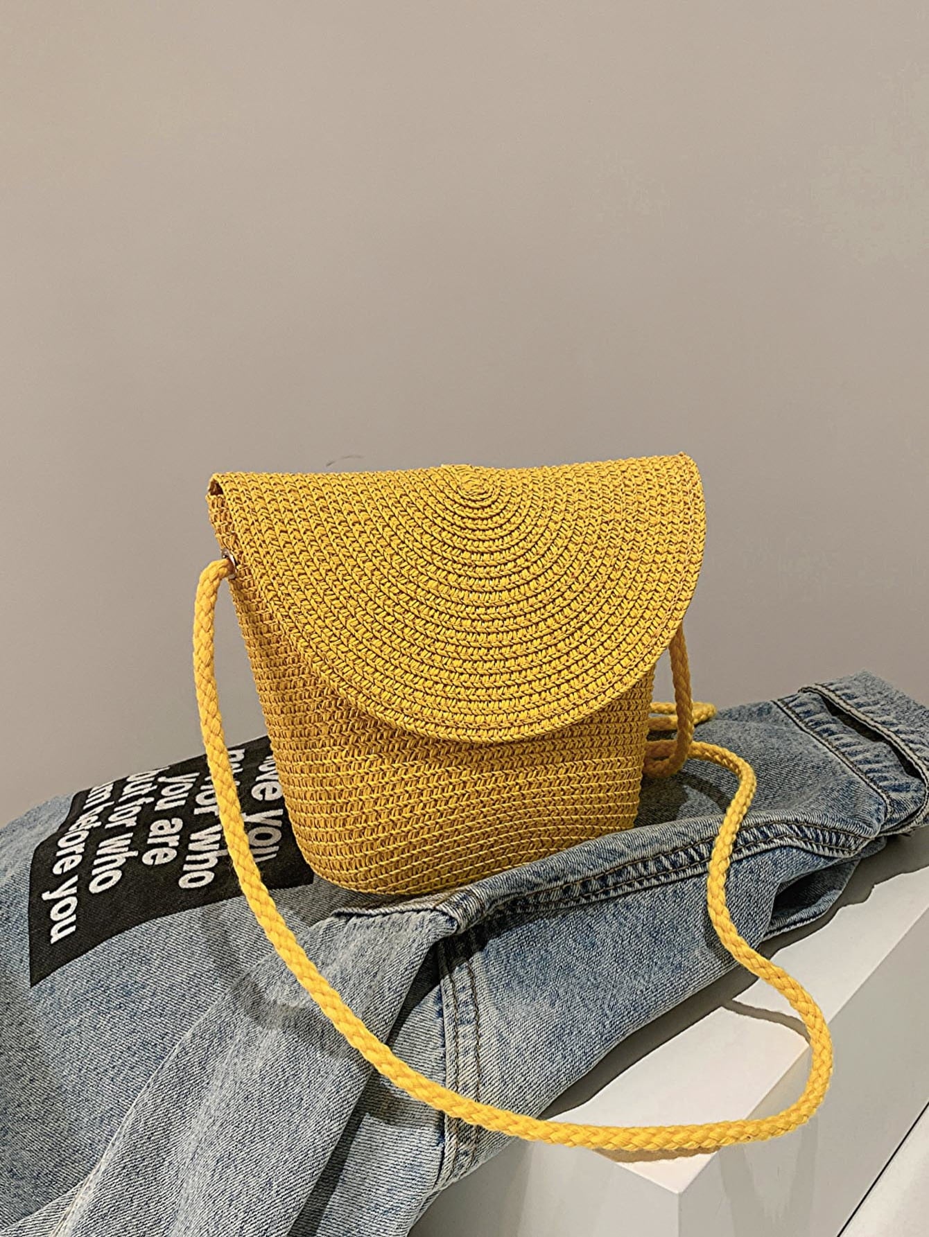 crochet shoulder handbag, mustard, front-view, on light blue denim jacket