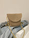 crochet shoulder handbag, camel, front view, atop a denim jacket