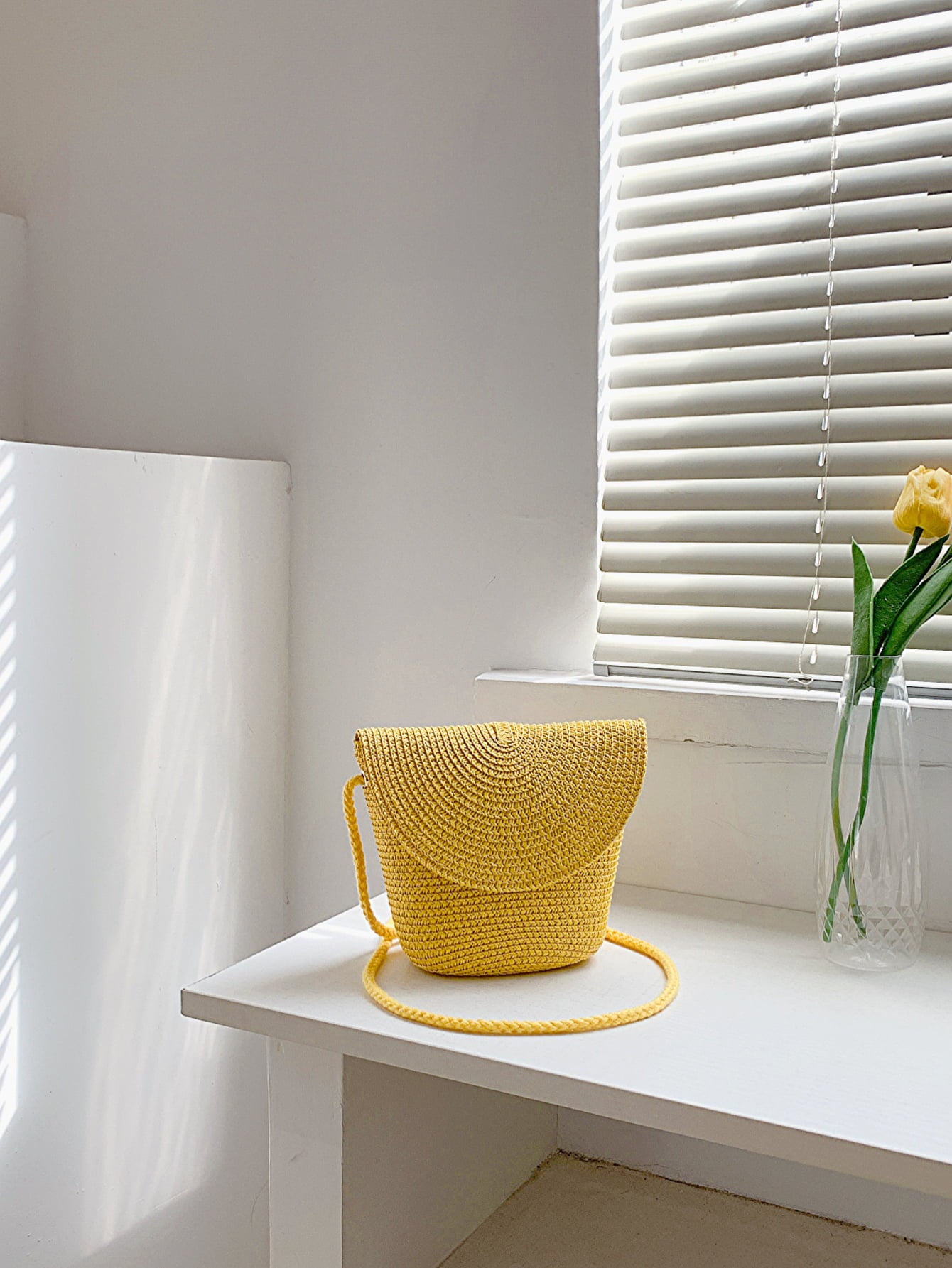 crochet shoulder handbag, mustard, front view, on white countertop