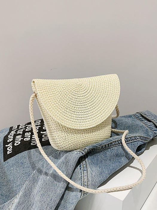 crochet shoulder handbag, cream, atop a denim jacket