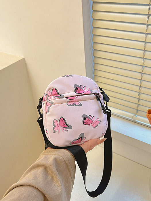 butterfly print polyester shoulder handbag, pink with pink butterflies, being held at arm's length in the palm of a woman's hand