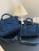 denim shoulder bag, dark blue, two differently sized bags atop a black table top